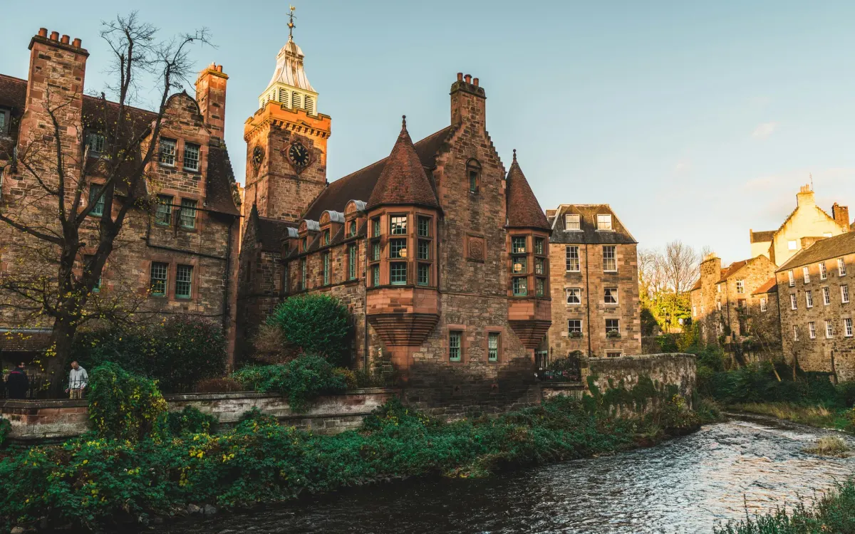 Stone buildings and trees beside the Water of Leith in Dean Village, Edinburgh